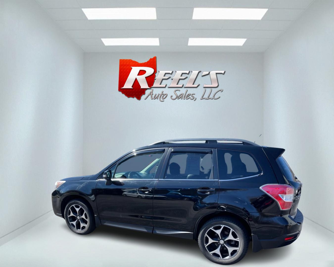 2014 Black /Black Subaru Forester 2.0XT Touring (JF2SJGMC4EH) with an 2.0L H4 SOHC 16V TURBO engine, Automatic transmission, located at 547 E. Main St., Orwell, OH, 44076, (440) 437-5893, 41.535435, -80.847855 - Photo#8